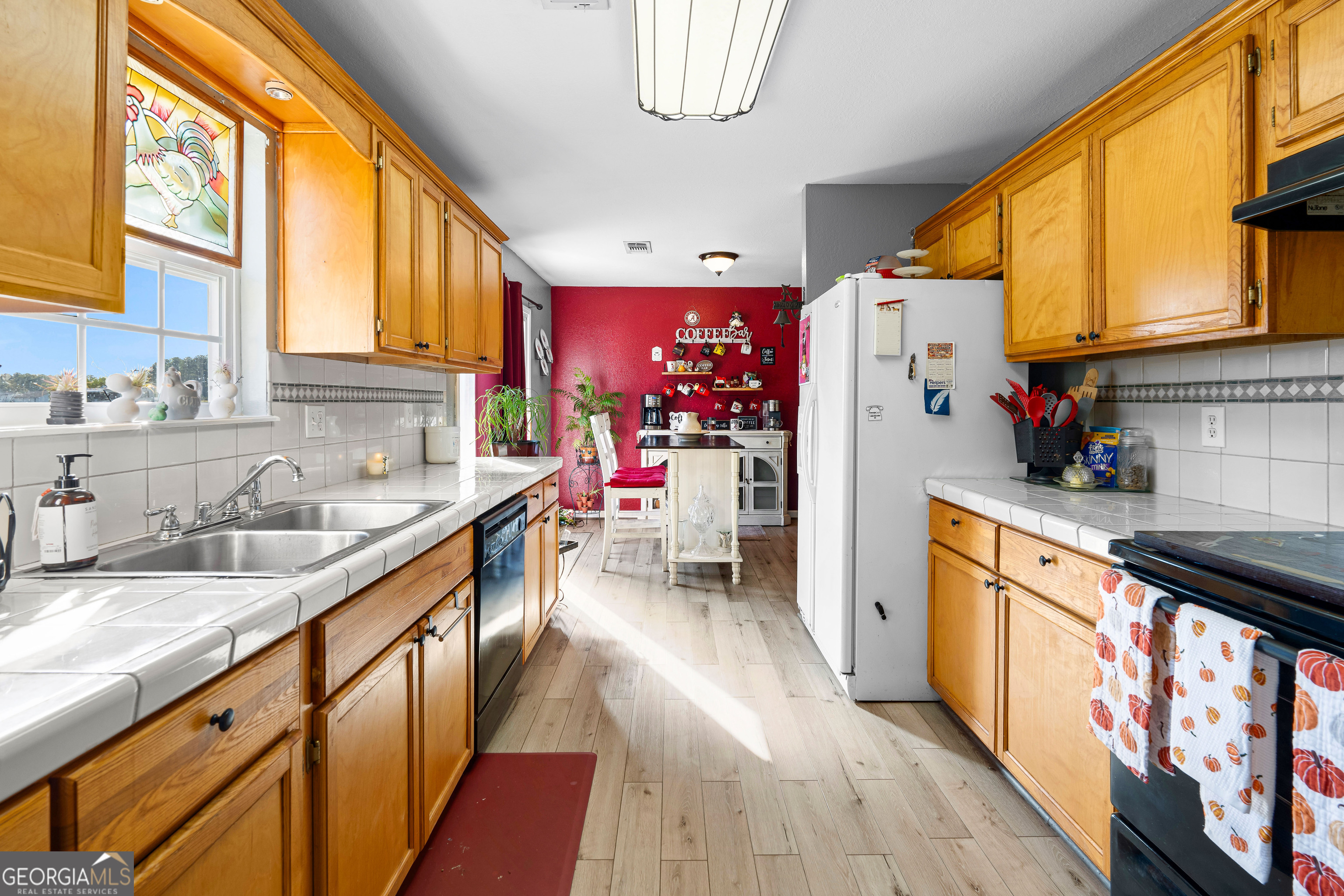 3939 Bevis Road Franklin, GA 30217 - Photo 18 of 40 a kitchen that has a lot of cabinets a sink and a stove in it