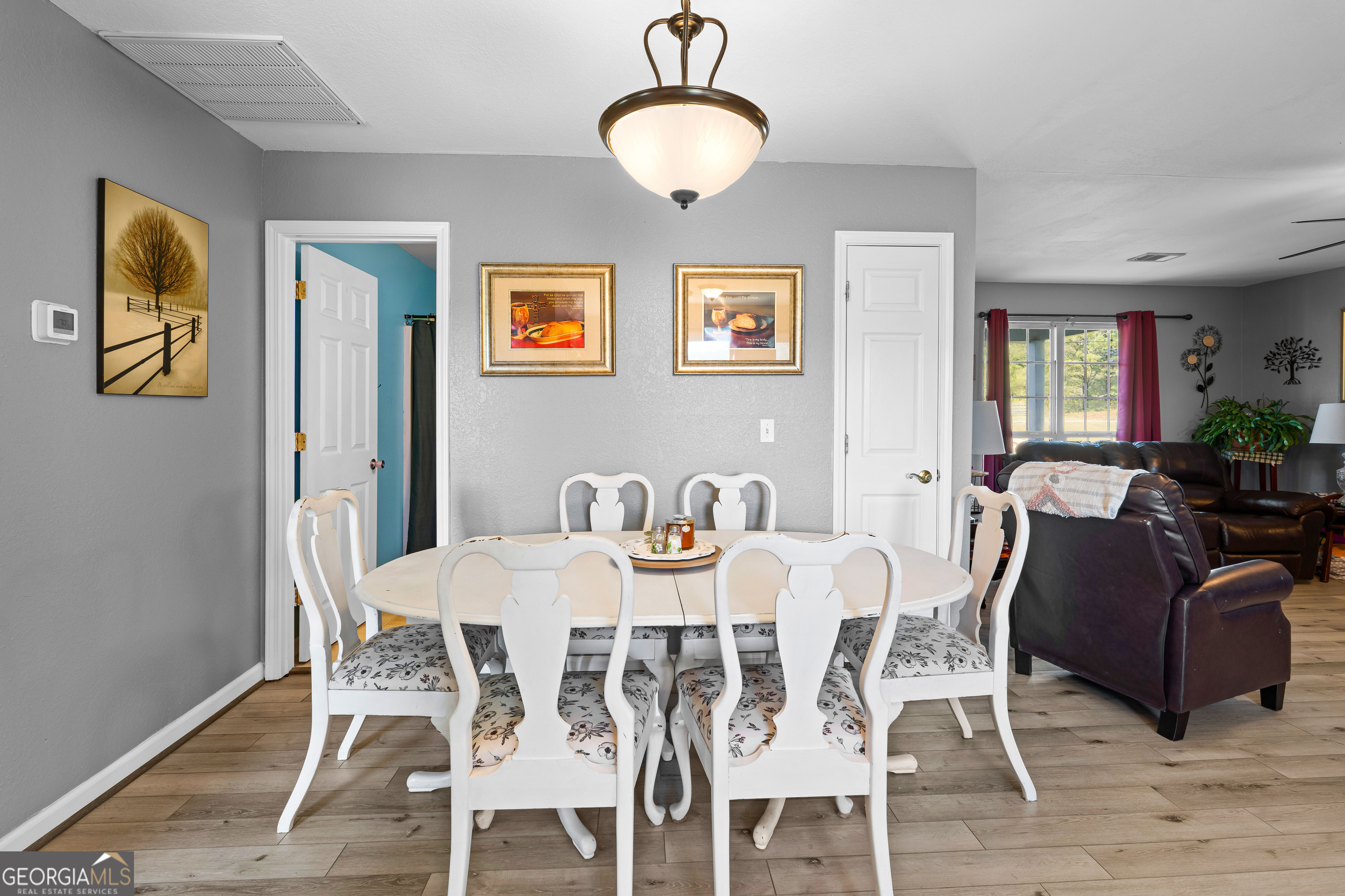 3939 Bevis Road Franklin, GA 30217 - Photo 22 of 40 a view of a dining room with furniture and wooden floor