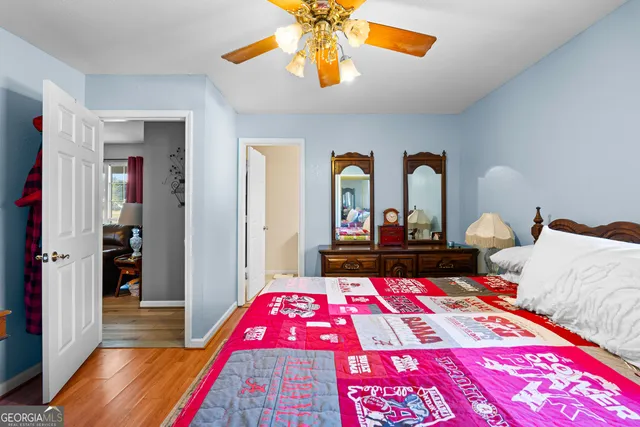a bed room with a bed and a chandelier