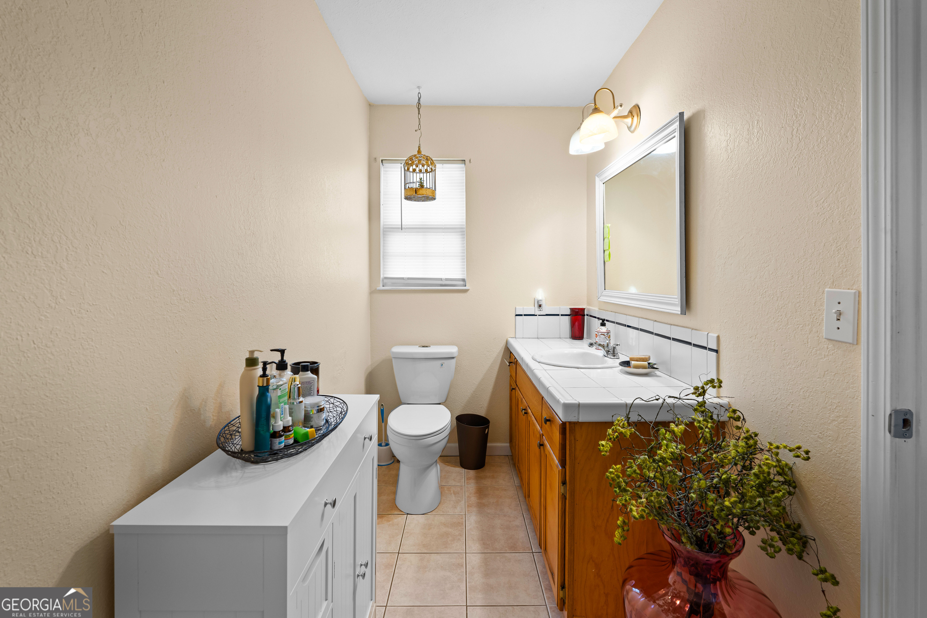 3939 Bevis Road Franklin, GA 30217 - Photo 25 of 40 a bathroom with a sink toilet and mirror