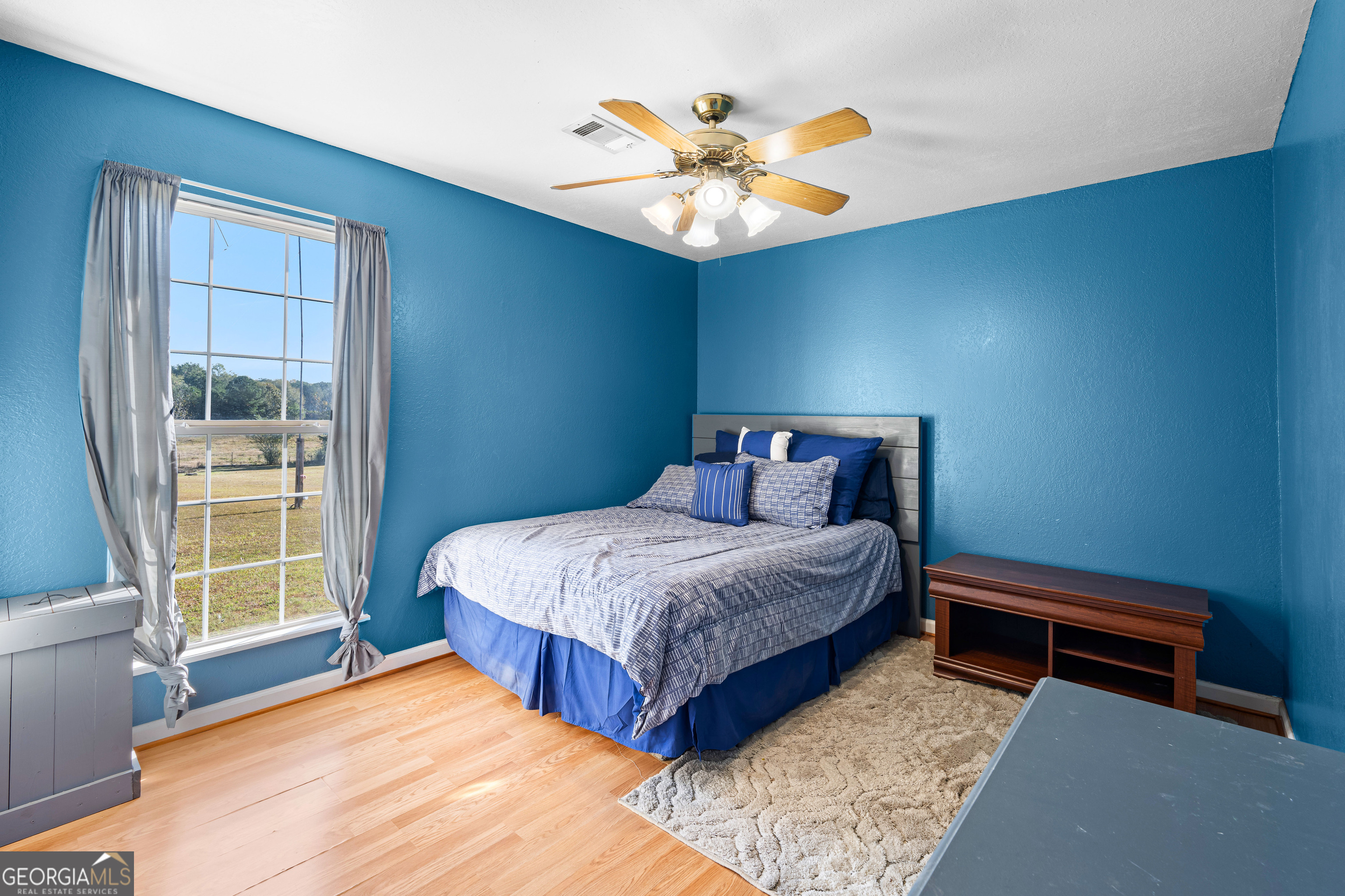 3939 Bevis Road Franklin, GA 30217 - Photo 26 of 40 a bedroom with a bed and a window