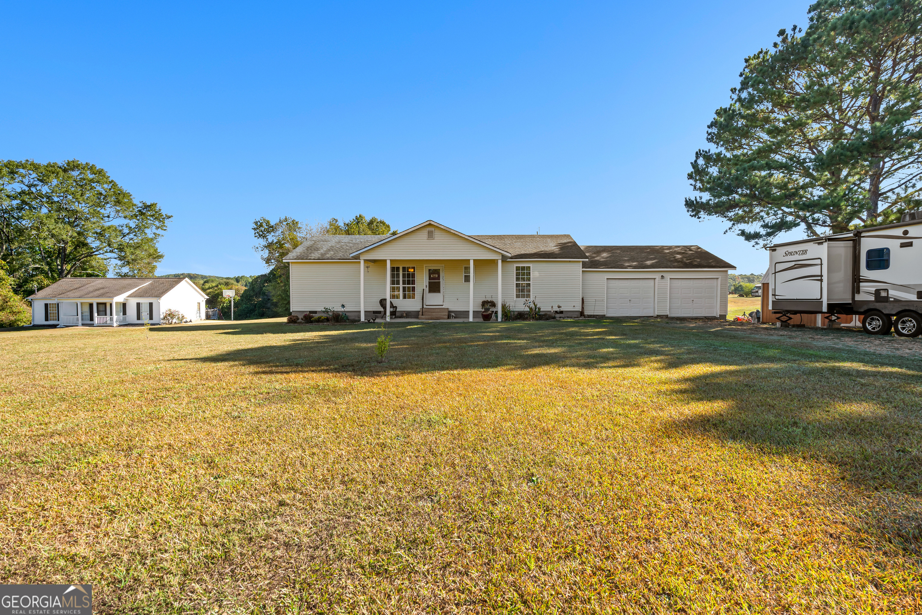 3939 Bevis Road Franklin, GA 30217 - Photo 3 of 40 a view of a house with a swimming pool