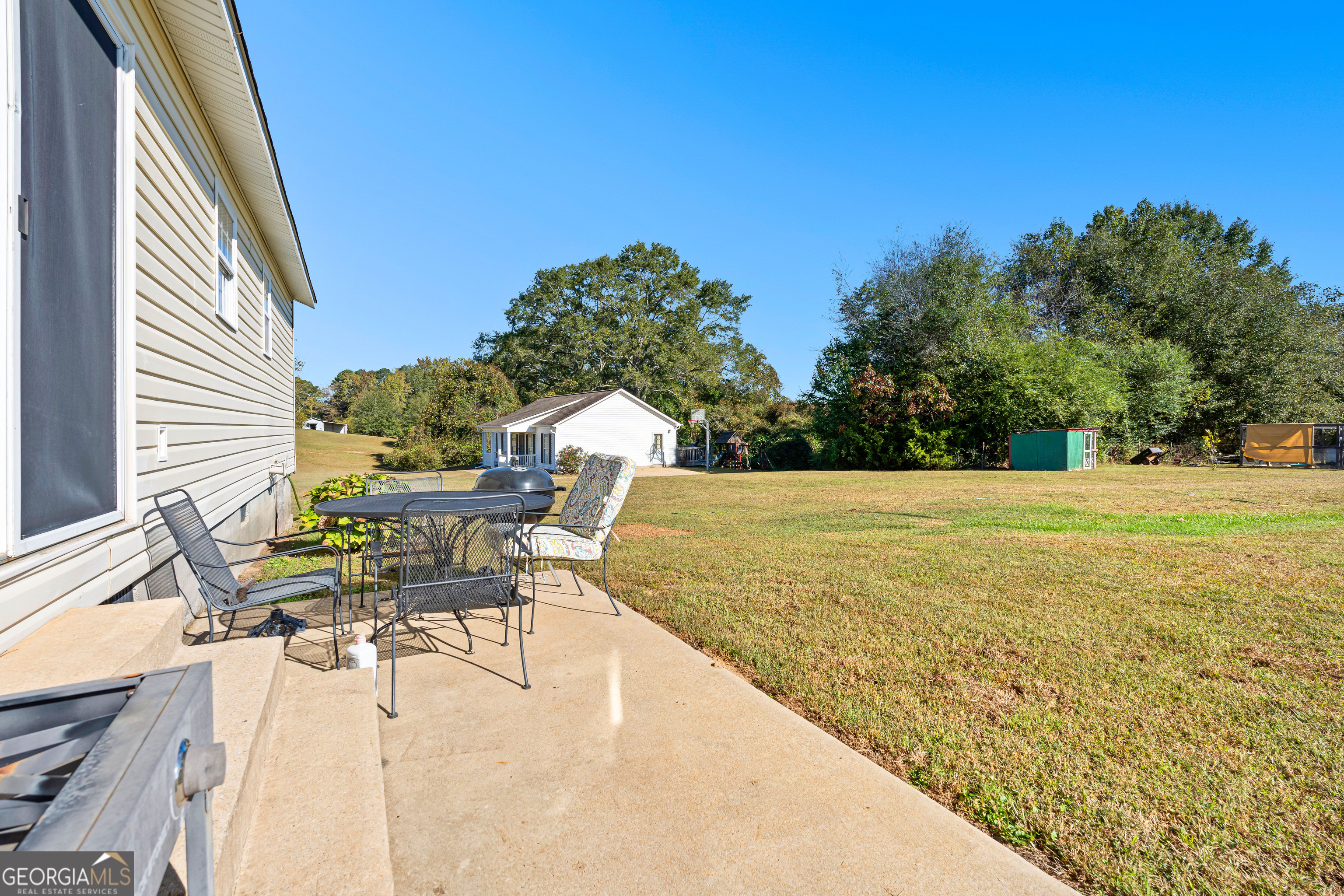 3939 Bevis Road Franklin, GA 30217 - Photo 34 of 40 a view of a swimming pool with a lounge chair