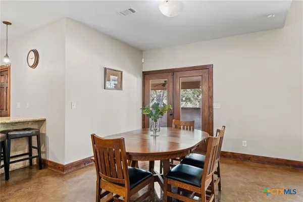 a bathroom with a toilet a sink and a mirror