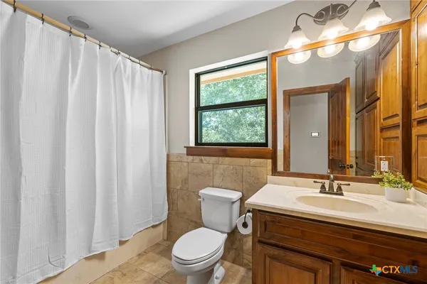 a view of a garage with a bike and a car