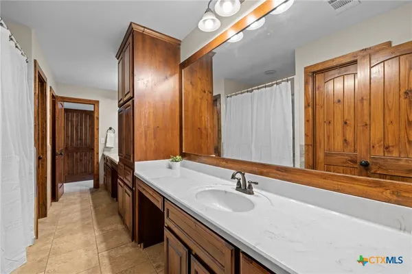a bedroom with a bed and wooden wall