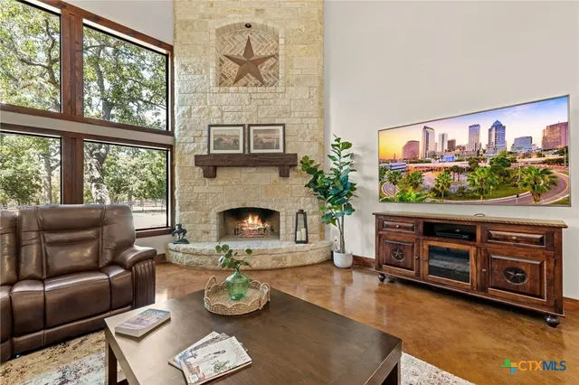 a spacious bedroom with a bed and wooden floor