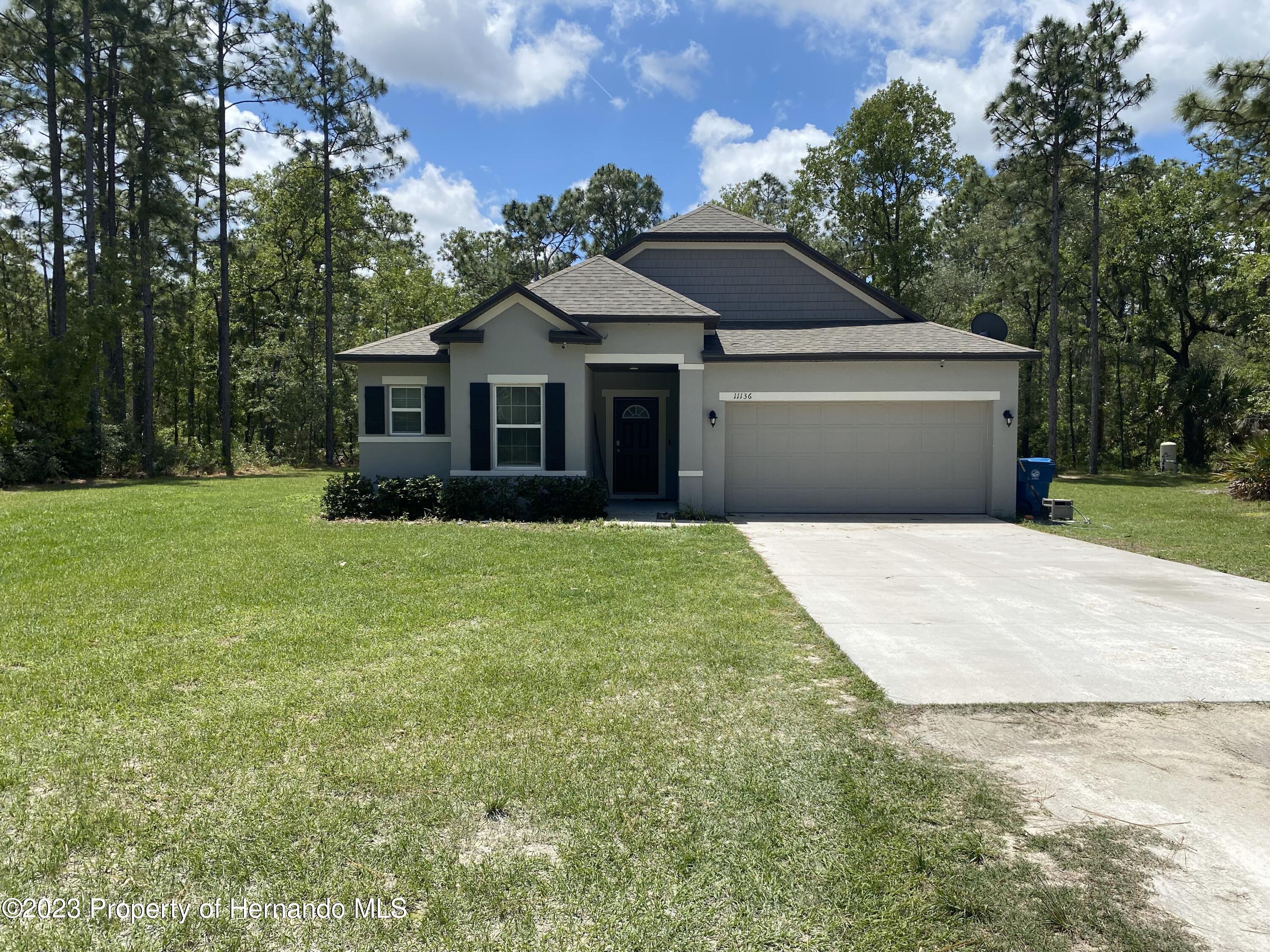 11136 Zarrian Road Brooksville, FL 34614 - Photo 1 of 14 Front