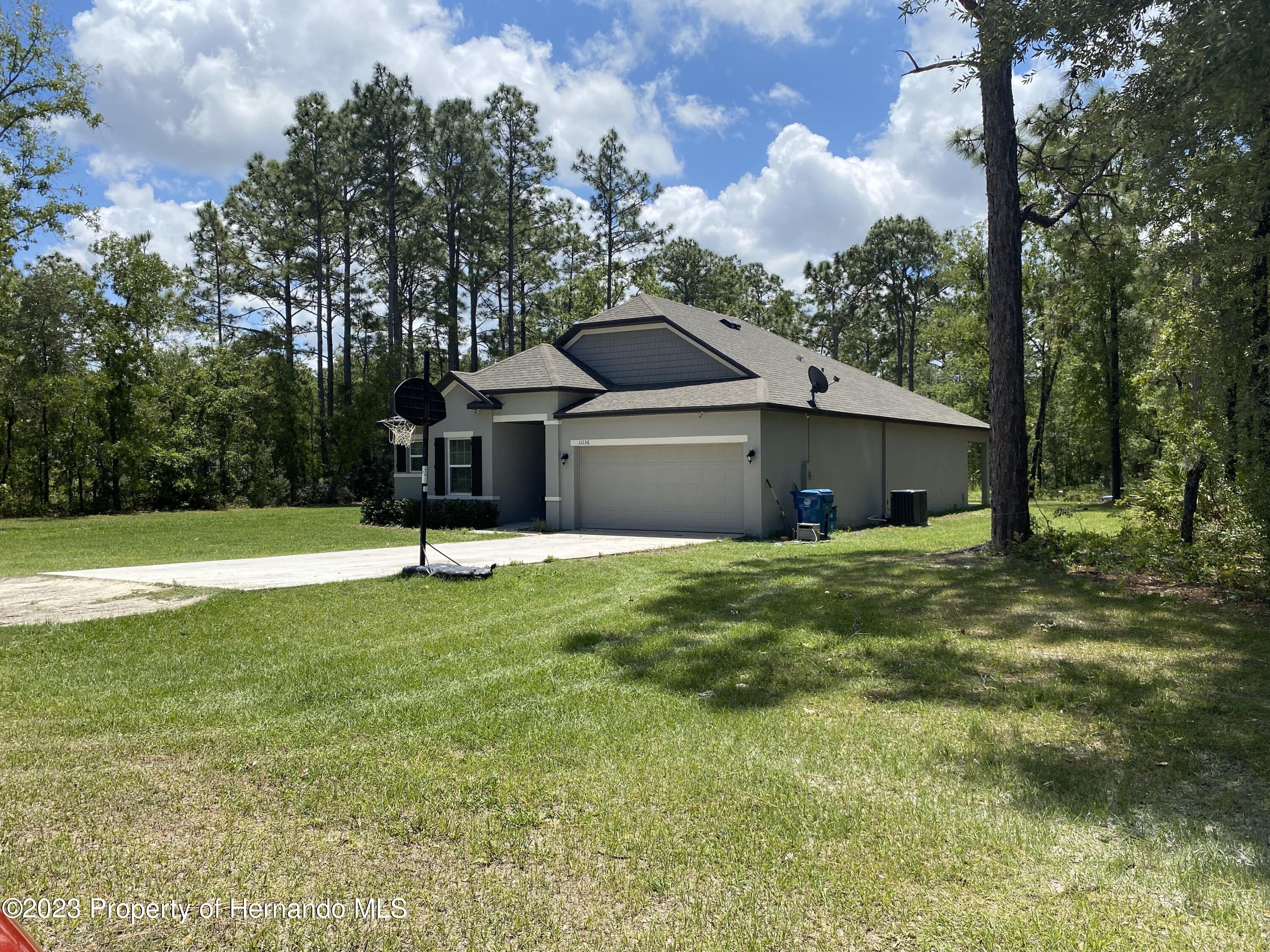 11136 Zarrian Road Brooksville, FL 34614 - Photo 2 of 14 Front Right