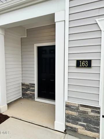 a bathroom with a toilet sink and a mirror