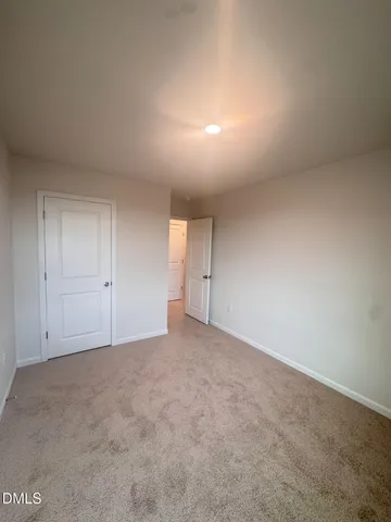 a white toilet sitting next to a bath tub