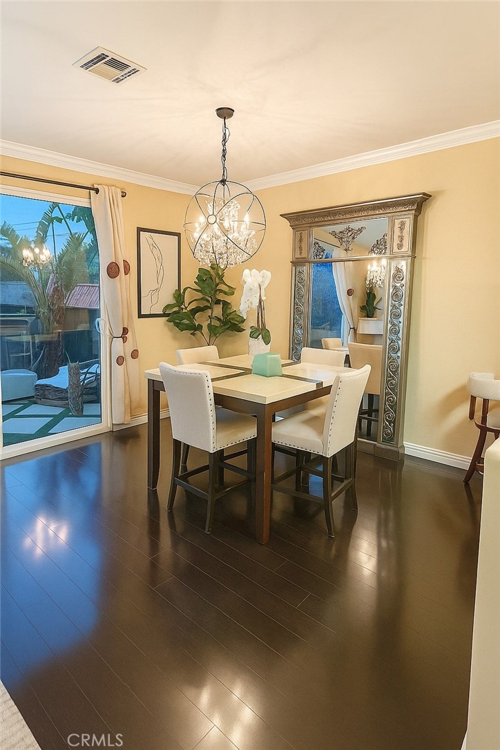 16706 Tim Lane Van Nuys, CA 91406 - Photo 4 of 16 a view of a dining room with furniture wooden floor and chandelier