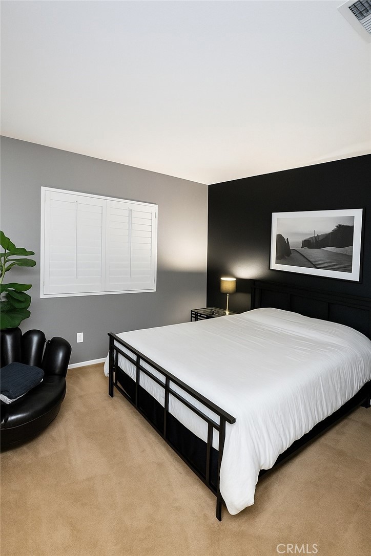 16706 Tim Lane Van Nuys, CA 91406 - Photo 9 of 16 a bedroom with a bed and window