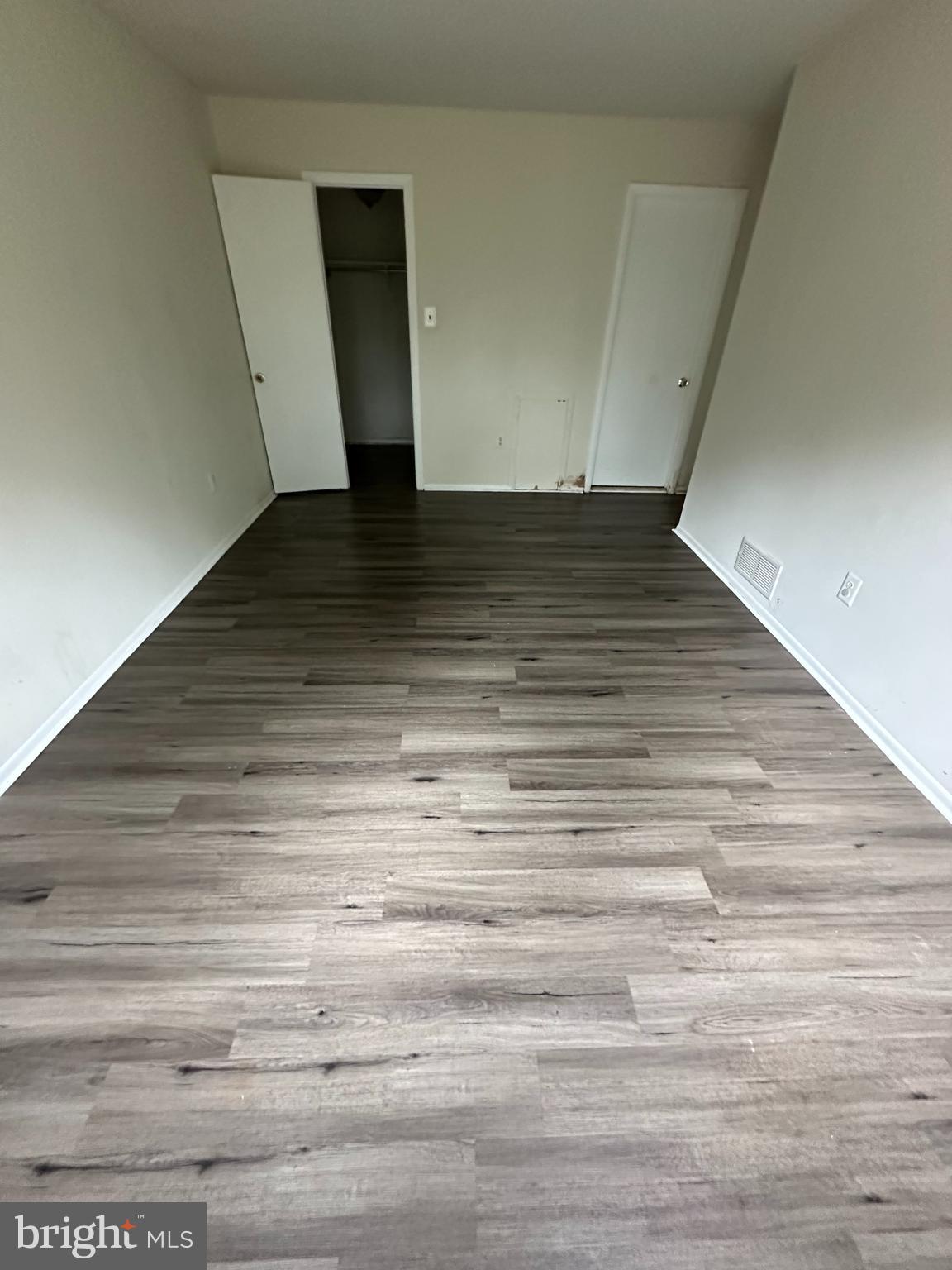 104 Willow Turn, Unit A Mount Laurel, NJ 08054 - Photo 8 of 8 a view of an empty room with wooden floor