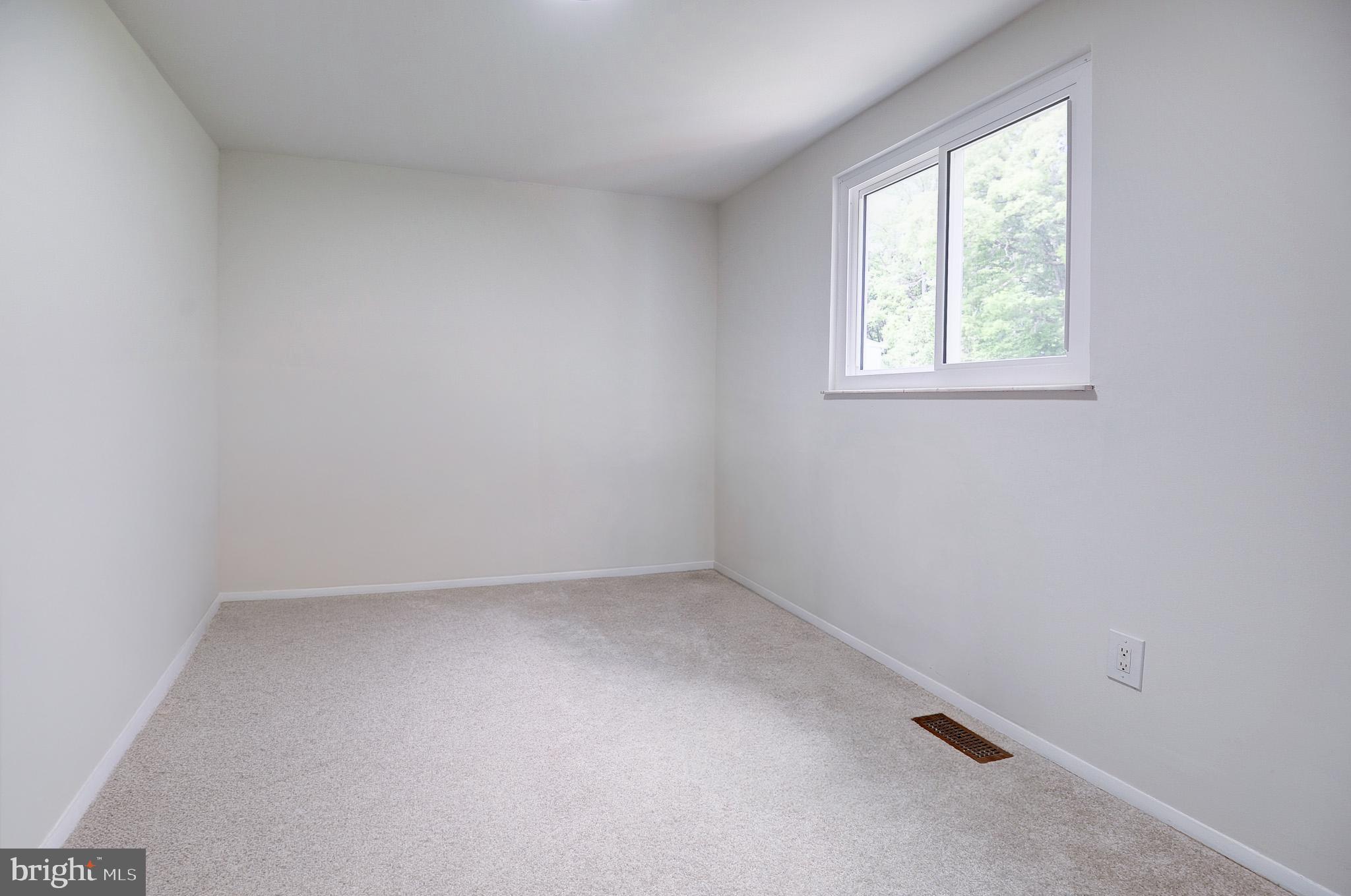 8416 Cedar Falls Court Springfield, VA 22153 - Photo 8 of 9 an empty room with a window