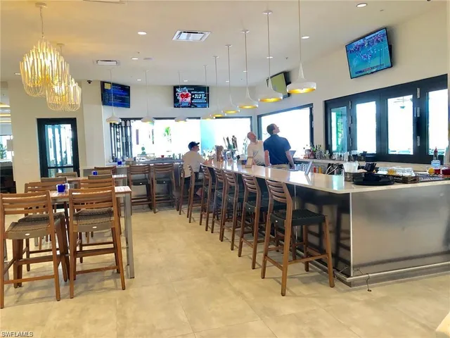 a view of a dining area with furniture and chandelier