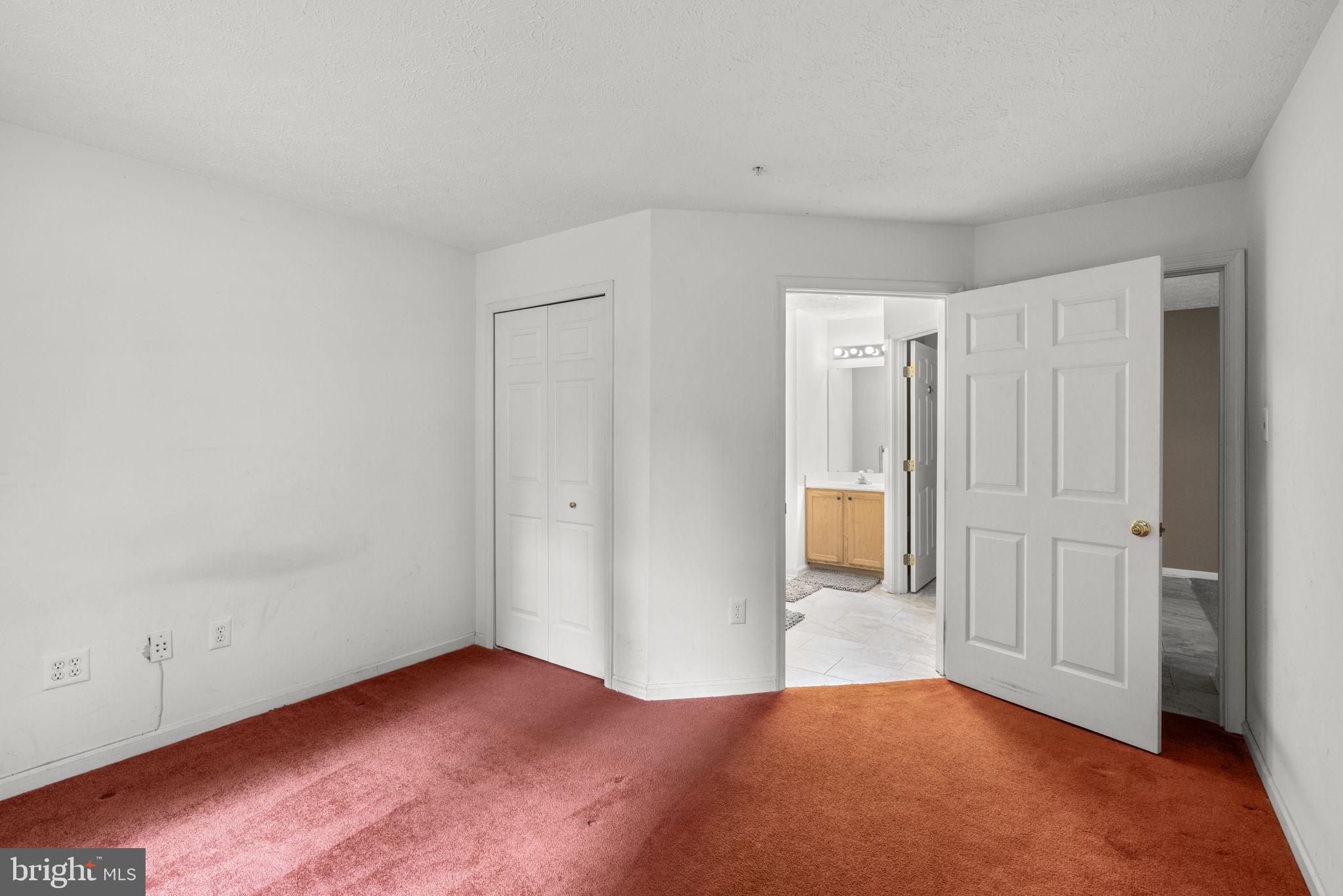 9713 Reese Farm Road, Unit 9713 Owings Mills, MD 21117 - Photo 15 of 30 a view of a livingroom with wooden floor and a bathroom