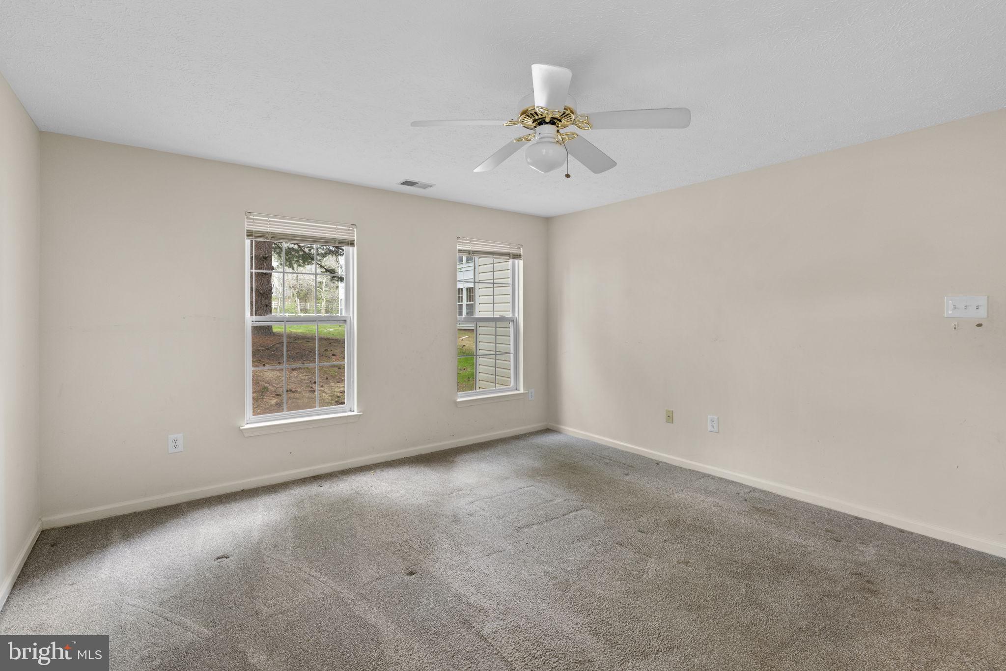9713 Reese Farm Road, Unit 9713 Owings Mills, MD 21117 - Photo 18 of 30 an empty room with windows and fan