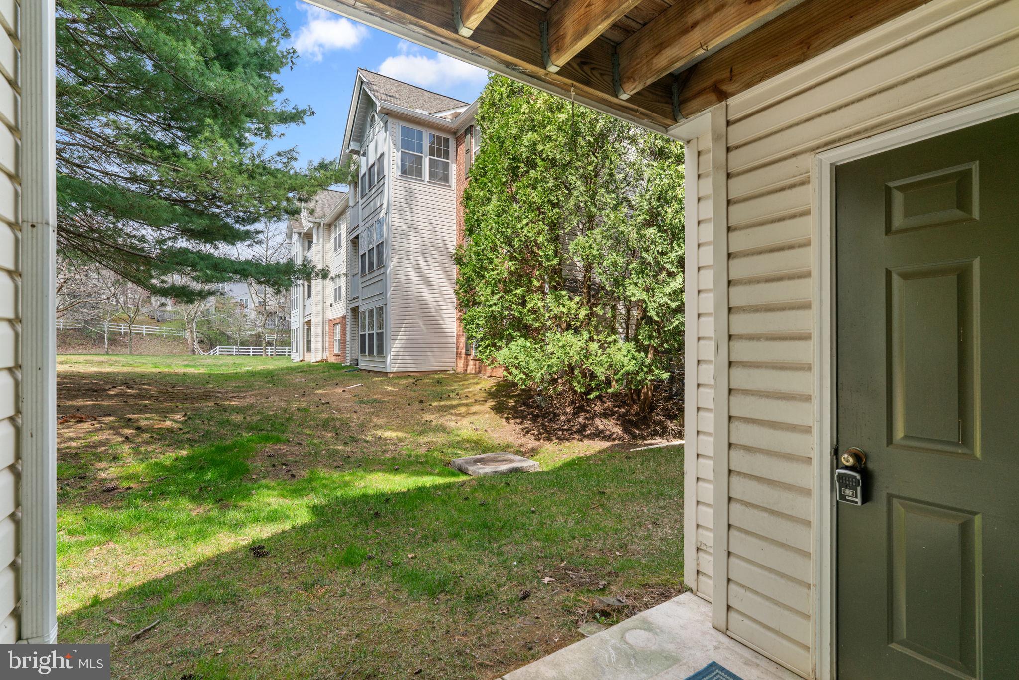 9713 Reese Farm Road, Unit 9713 Owings Mills, MD 21117 - Photo 21 of 30 a view of a backyard with garden