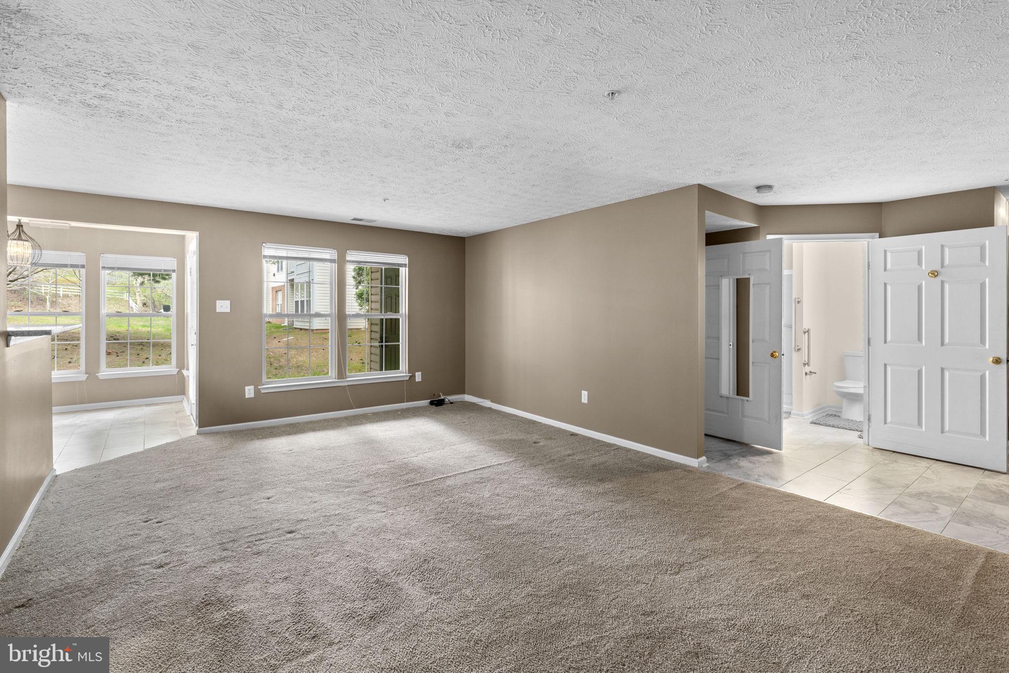 9713 Reese Farm Road, Unit 9713 Owings Mills, MD 21117 - Photo 6 of 30 an empty room with windows