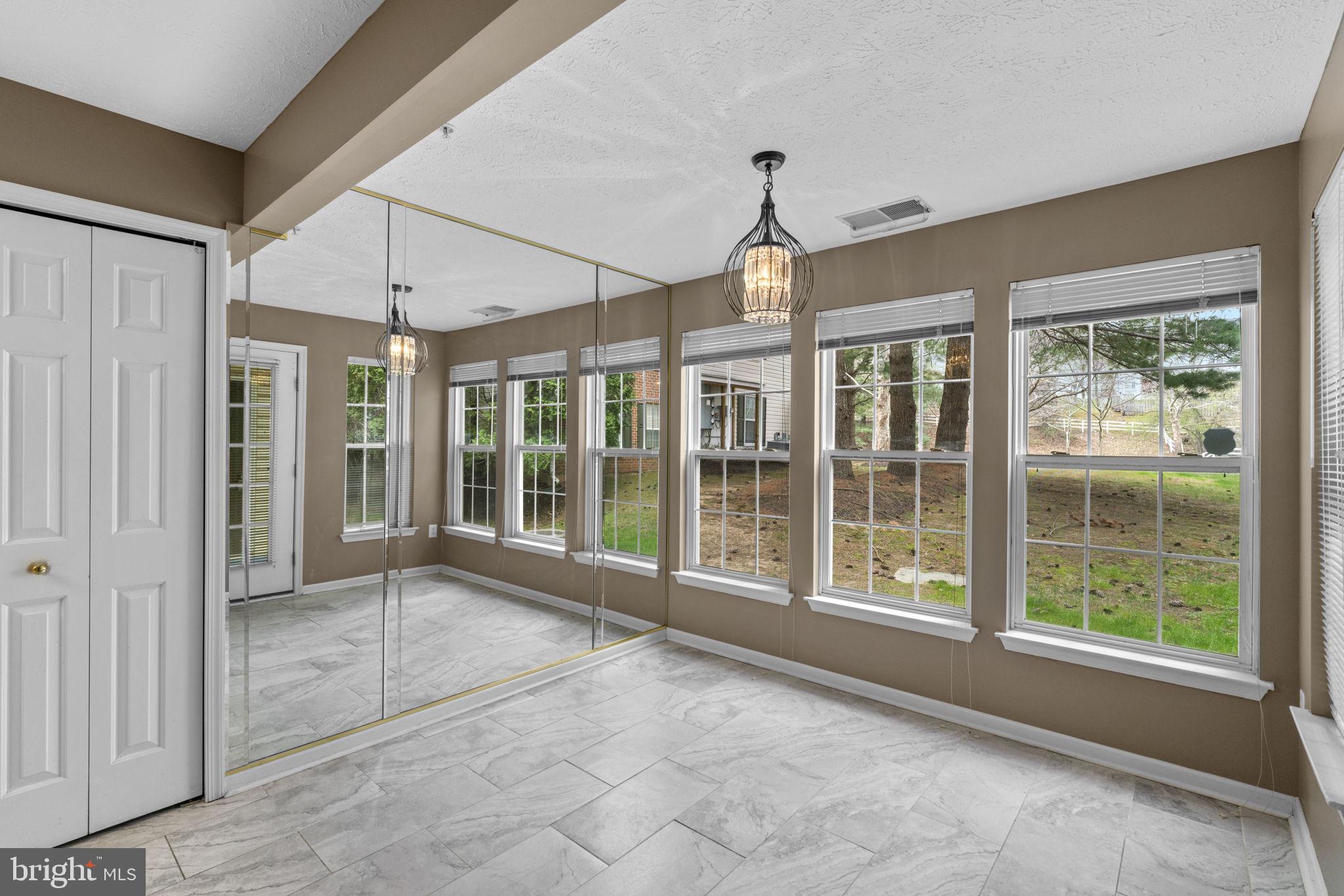 9713 Reese Farm Road, Unit 9713 Owings Mills, MD 21117 - Photo 7 of 30 a view of empty room with windows