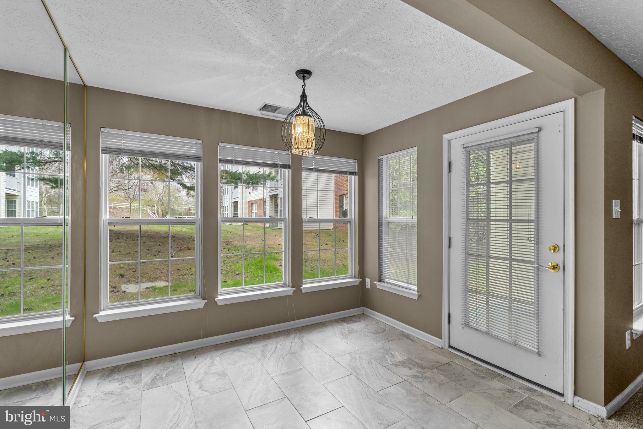 9713 Reese Farm Road, Unit 9713 Owings Mills, MD 21117 - Photo 8 of 30 a view of an empty room with a window