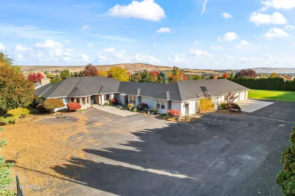 a view of a large house with a yard