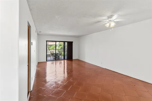 a view of a patio with a dining table and chairs