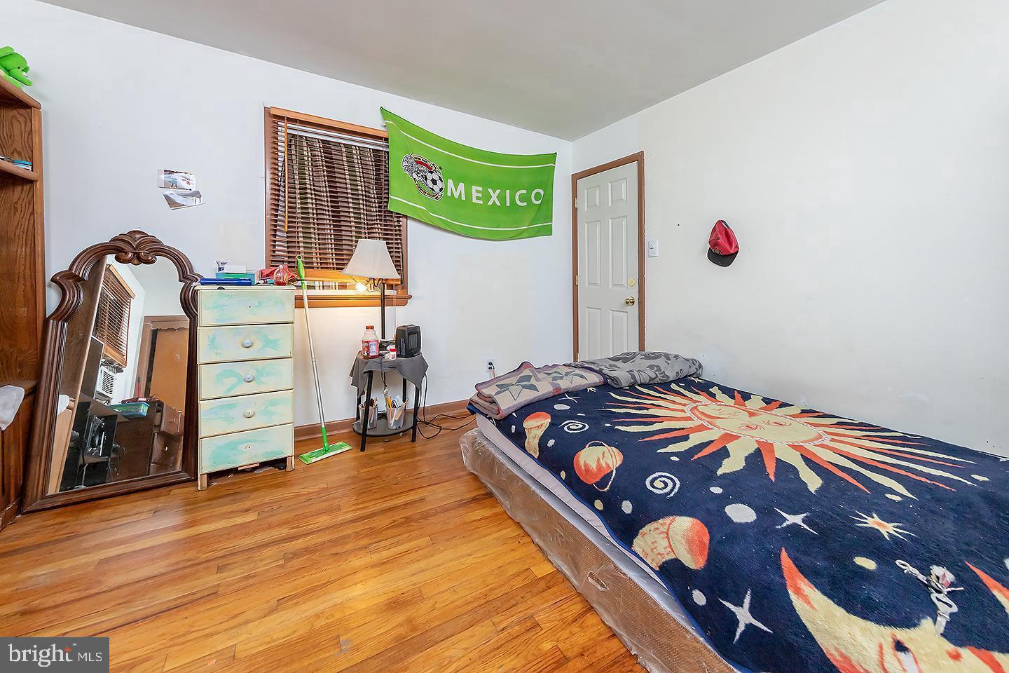 217 University Boulevard Glassboro, NJ 08028 - Photo 14 of 23 a bedroom with a bed and a dresser