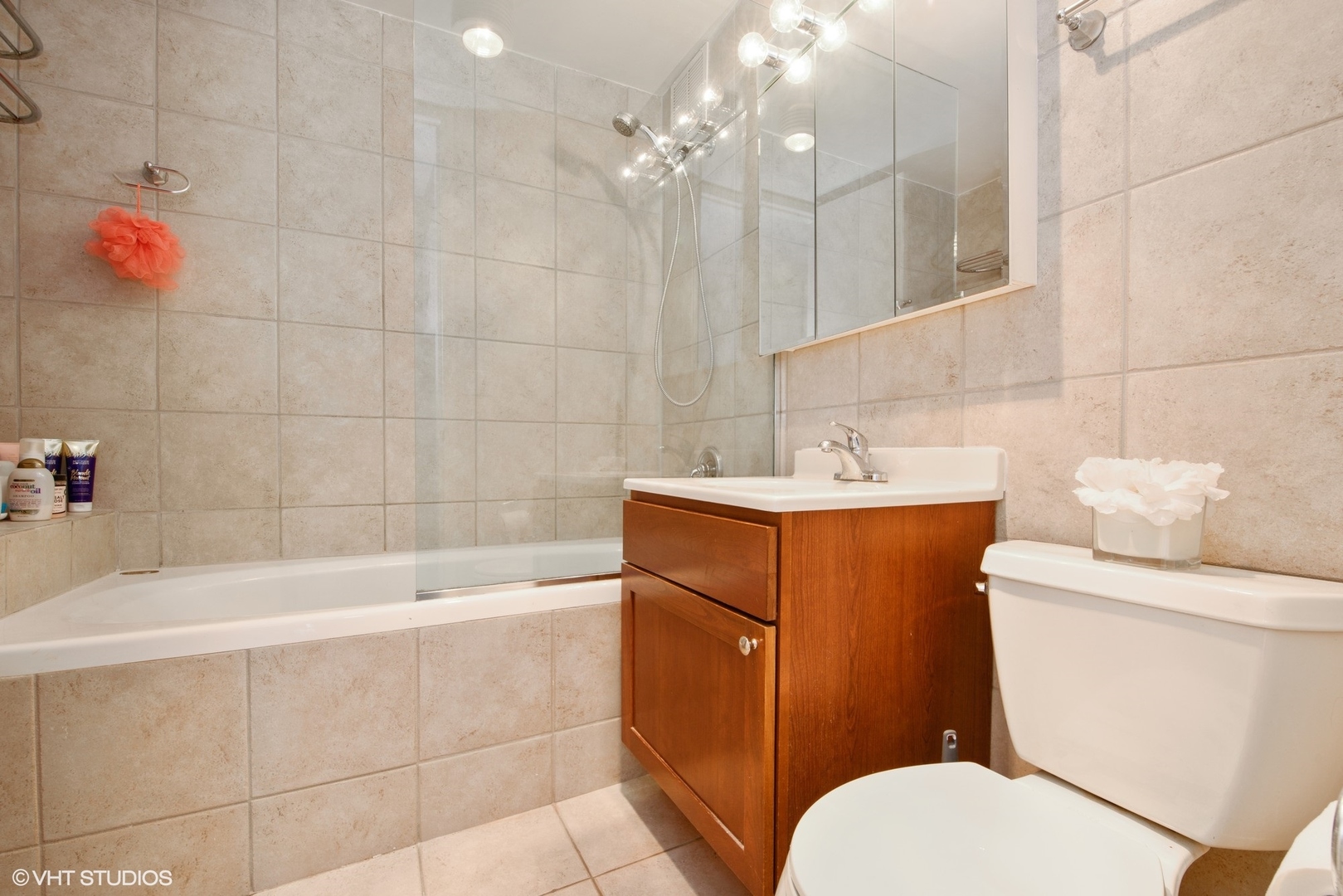 655 West Irving Park Road, Unit 1614 Chicago, IL 60613 - Photo 11 of 22 a bathroom with a sink a toilet and bathtub