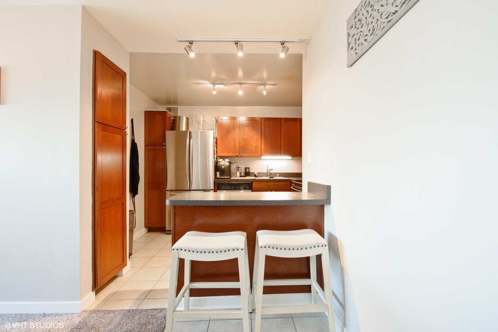 655 West Irving Park Road, Unit 1614 Chicago, IL 60613 - Photo 6 of 22 a room with a table and chairs