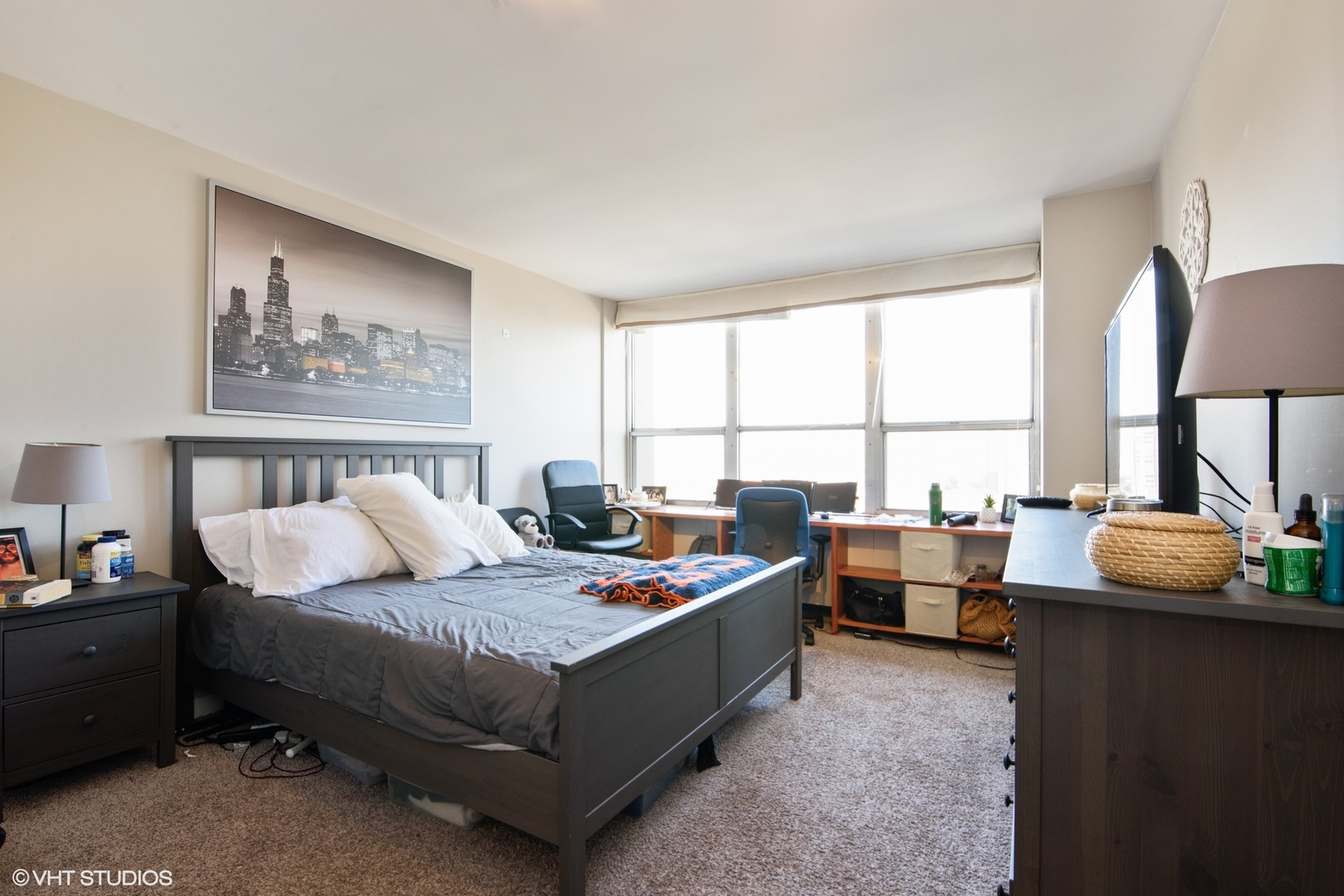 655 West Irving Park Road, Unit 1614 Chicago, IL 60613 - Photo 9 of 22 a bedroom with furniture and a window