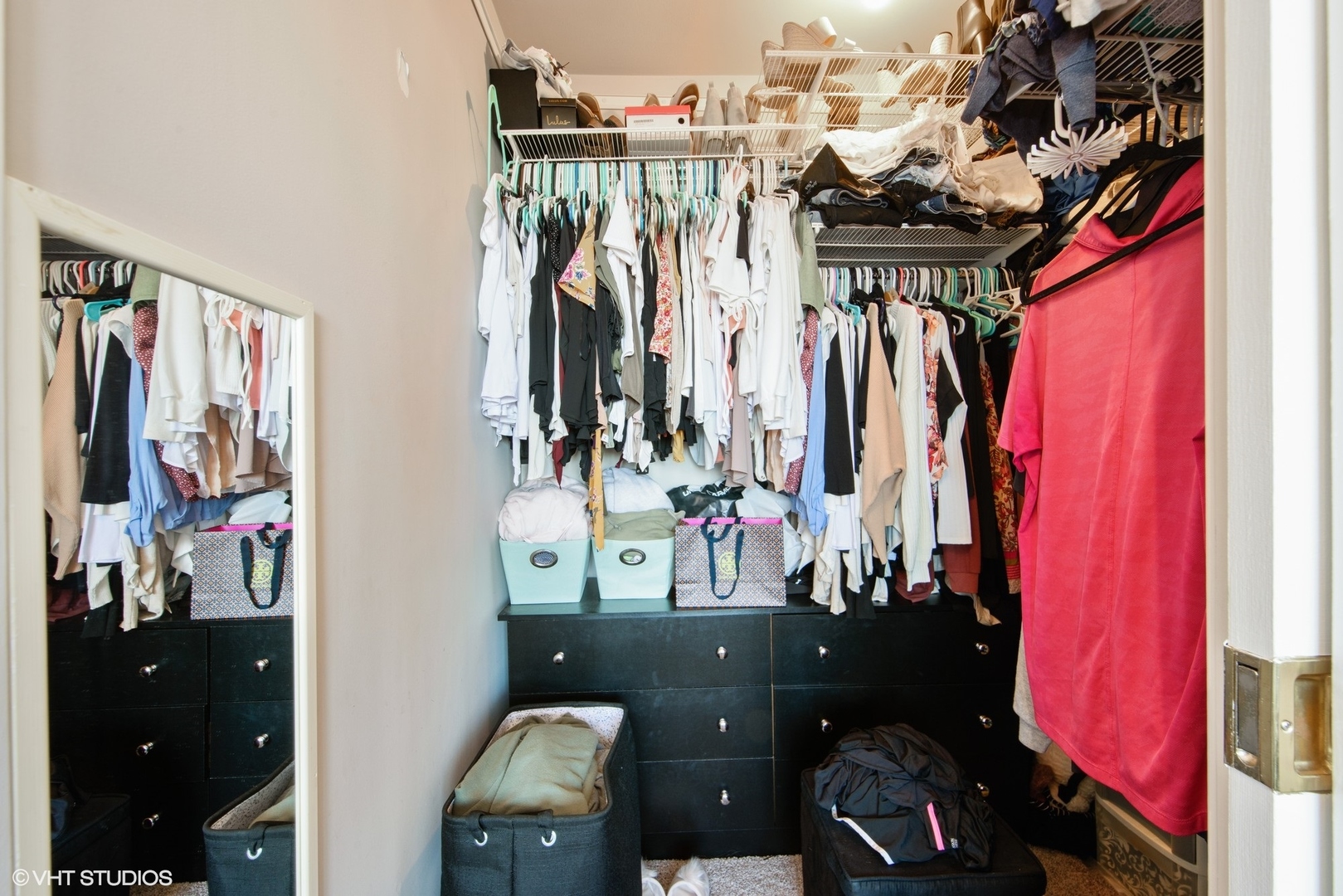 655 West Irving Park Road, Unit 1614 Chicago, IL 60613 - Photo 10 of 22 a view of walk in closet with clothes and shoes