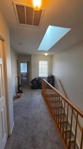 a view of hallway with livingroom