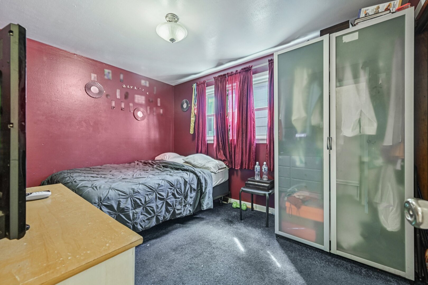 10102 S Lane Chicago, IL 60628 - Photo 11 of 15 a bedroom with a bed and a mirror