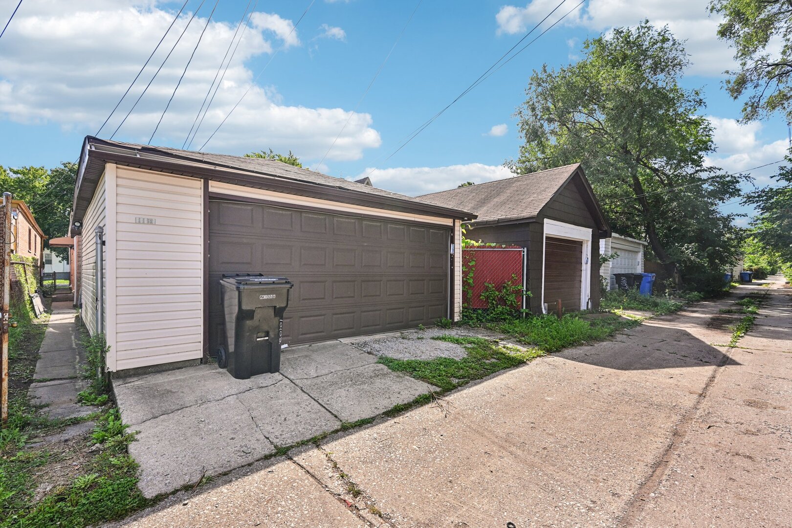10102 S Lane Chicago, IL 60628 - Photo 15 of 15 a front view of a house with a yard and garage