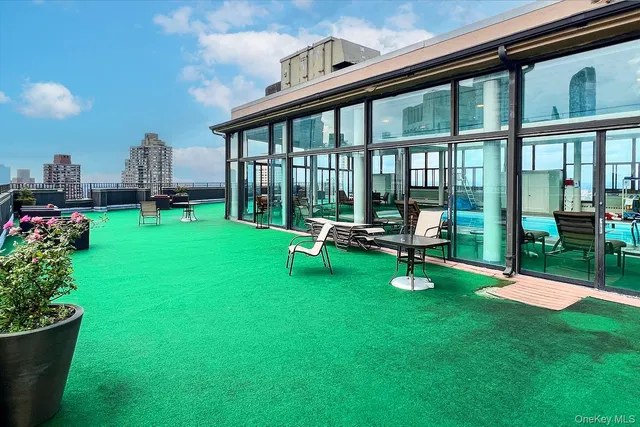 a view of yard with a slide and swing