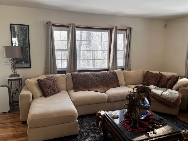 a living room with furniture or couch and a window