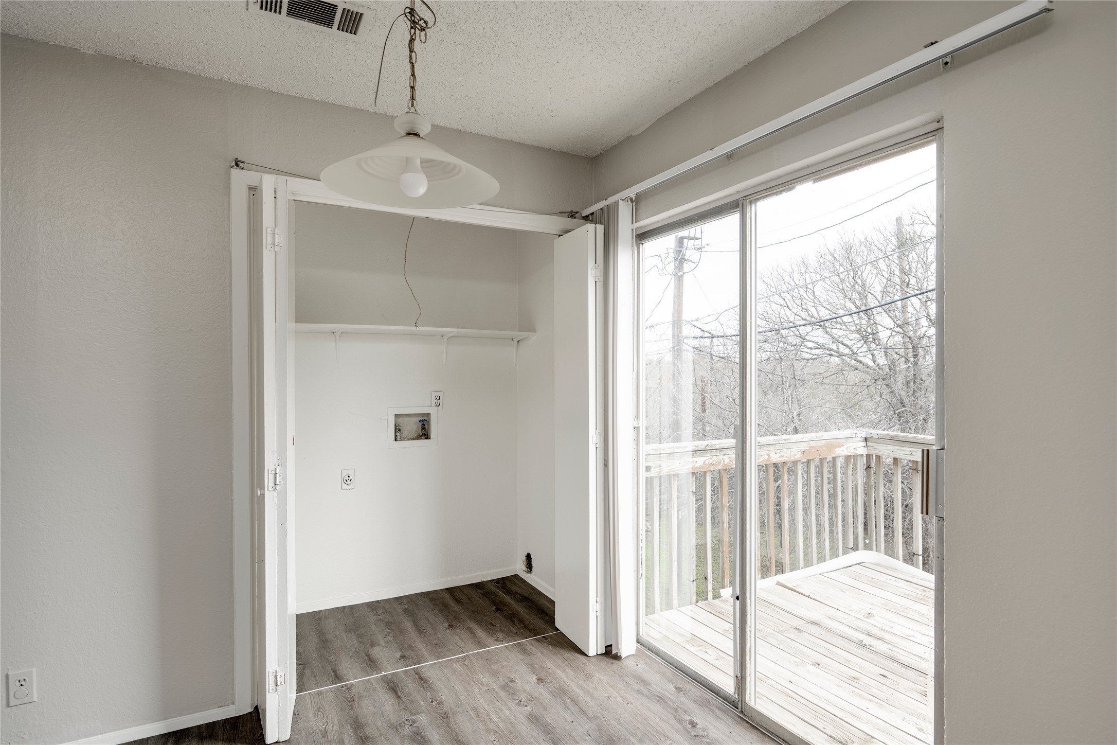 11907 Alpheus Avenue, Unit D Austin, TX 78759 - Photo 13 of 26 a view of a room with wooden floor and balcony