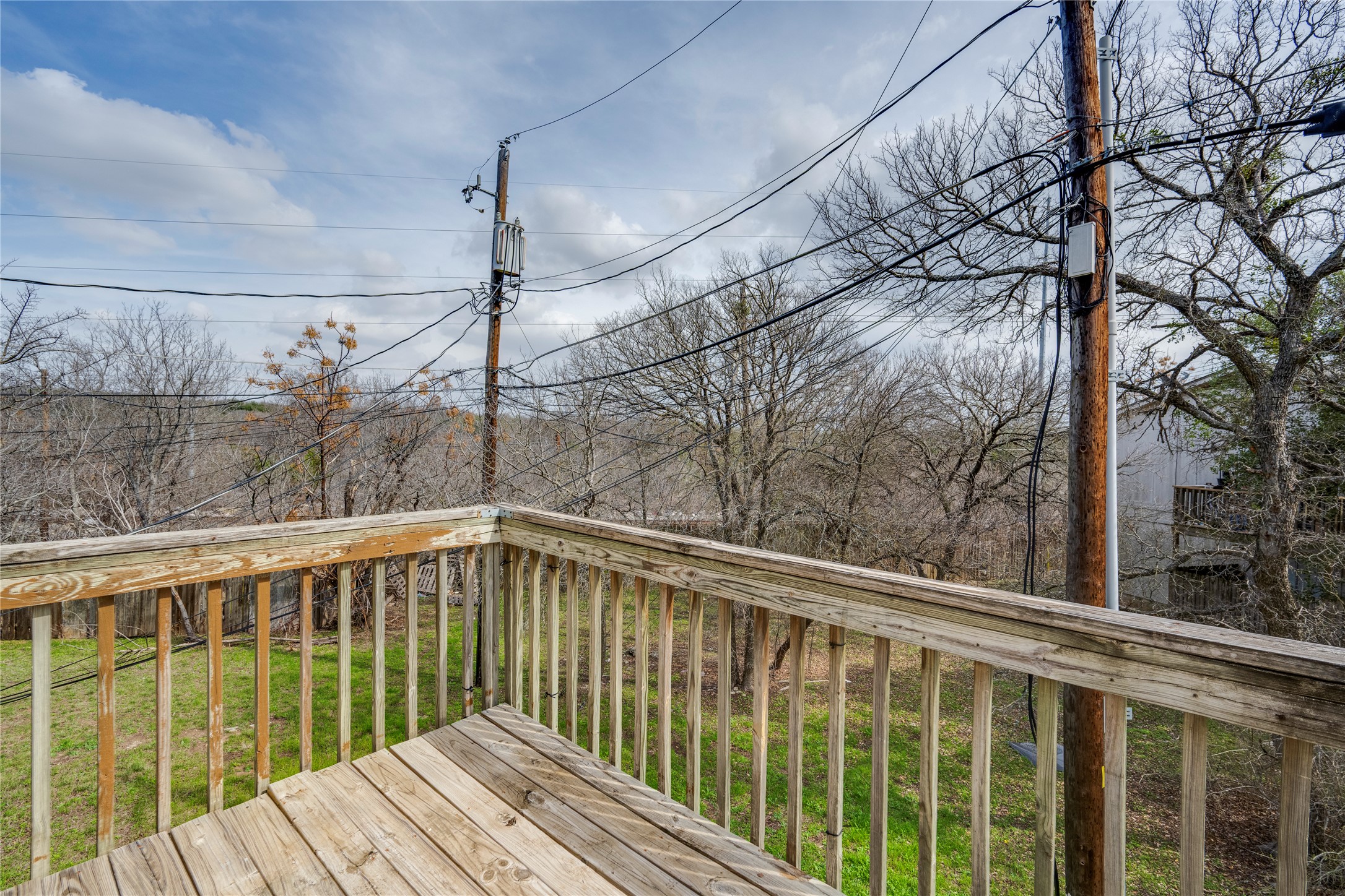 11907 Alpheus Avenue, Unit D Austin, TX 78759 - Photo 22 of 26 a view of a balcony with wooden floor