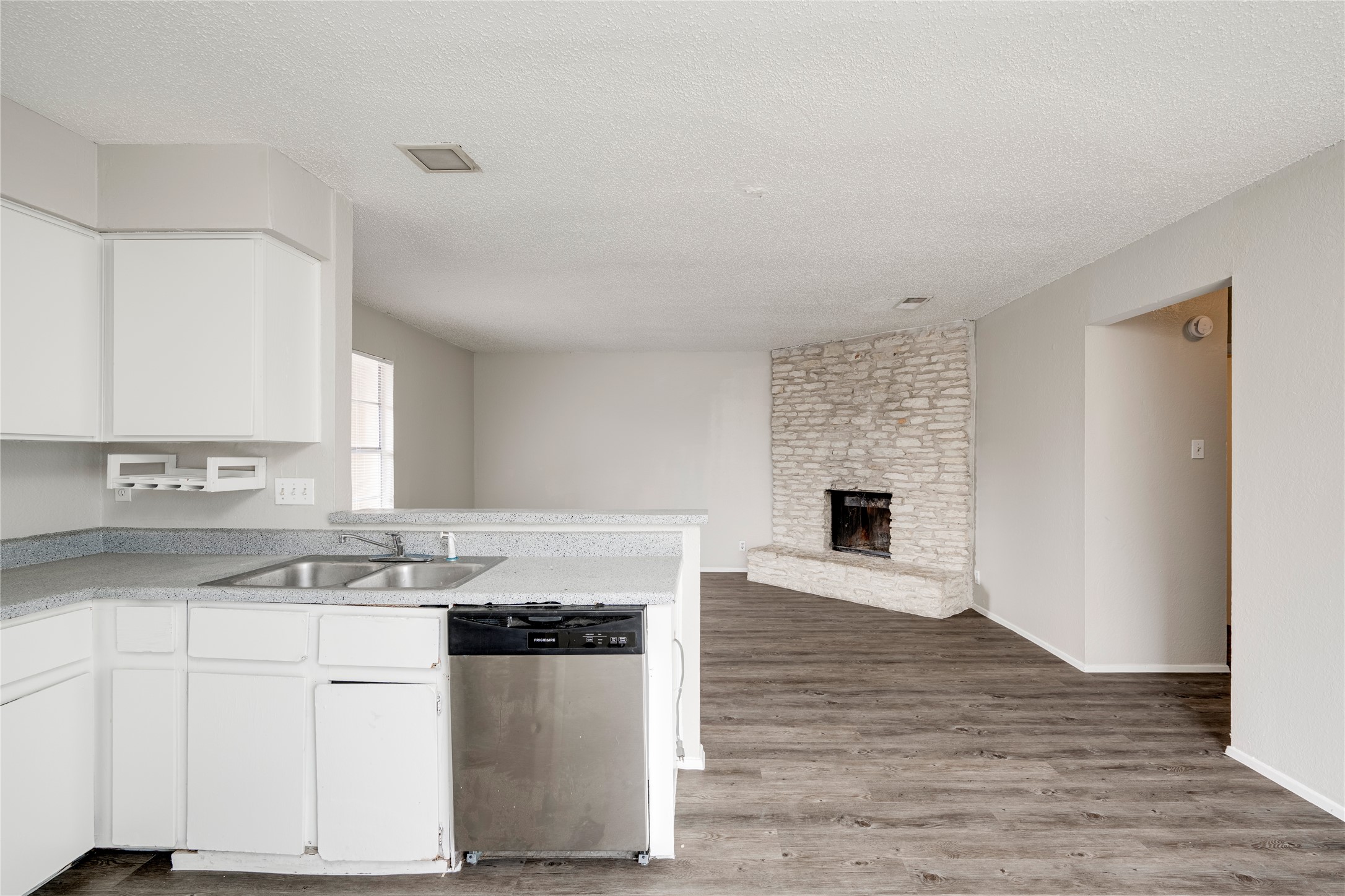 11907 Alpheus Avenue, Unit D Austin, TX 78759 - Photo 8 of 26 a kitchen with granite countertop a stove and a sink