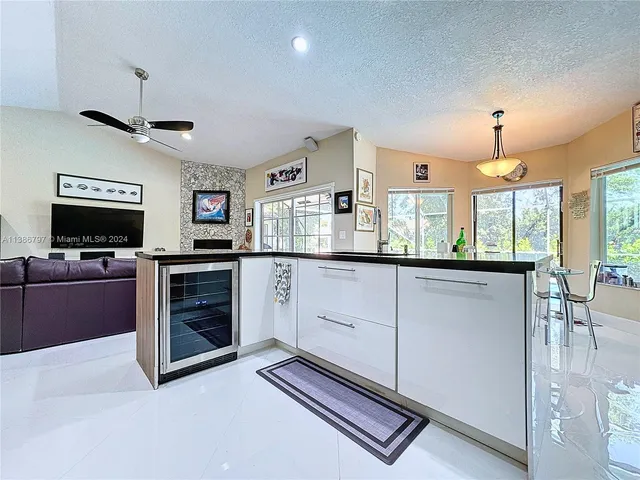 a kitchen with stainless steel appliances granite countertop a stove and a sink