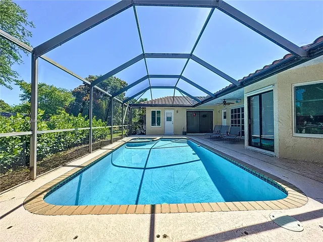 a view of swimming pool with seating area