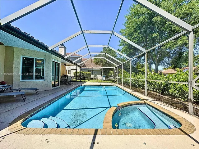 a view of a swimming pool with a patio