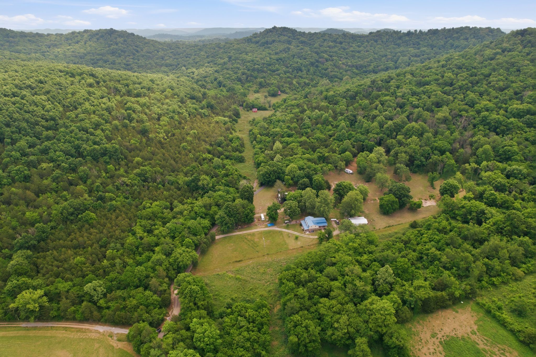 1780 Chumley Hollow Road Watertown, TN 37184 - Photo 14 of 14 a view of a city with lush green forest