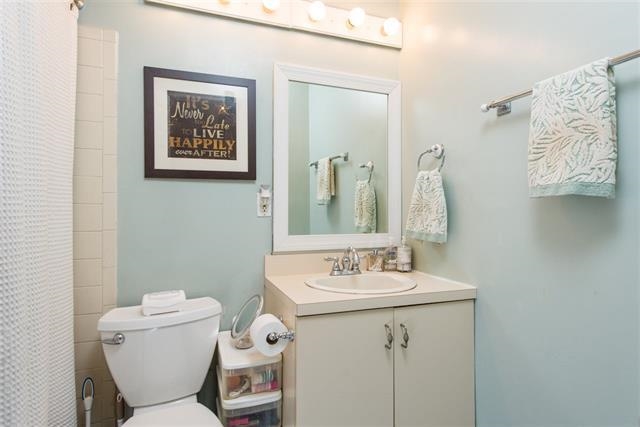 222 Clinton Street, Unit 21 Hoboken, NJ 07030 - Photo 6 of 9 a bathroom with a toilet sink and mirror