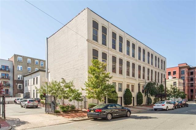 222 Clinton Street, Unit 21 Hoboken, NJ 07030 - Photo 9 of 9 a view of a building and car parked on the side of road