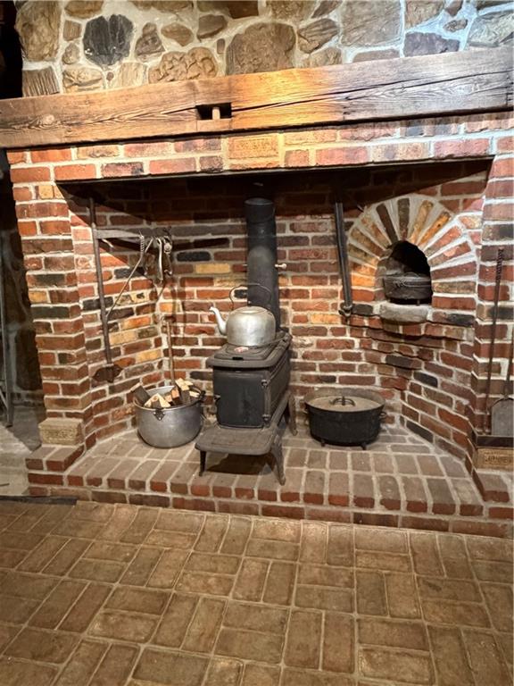 265 Jack Road Vandergrift, PA 15690 - Photo 36 of 44 Fireplace in the basement with a wood burner insert