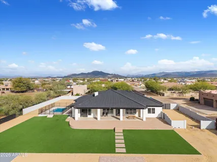 an aerial view of residential houses with outdoor space