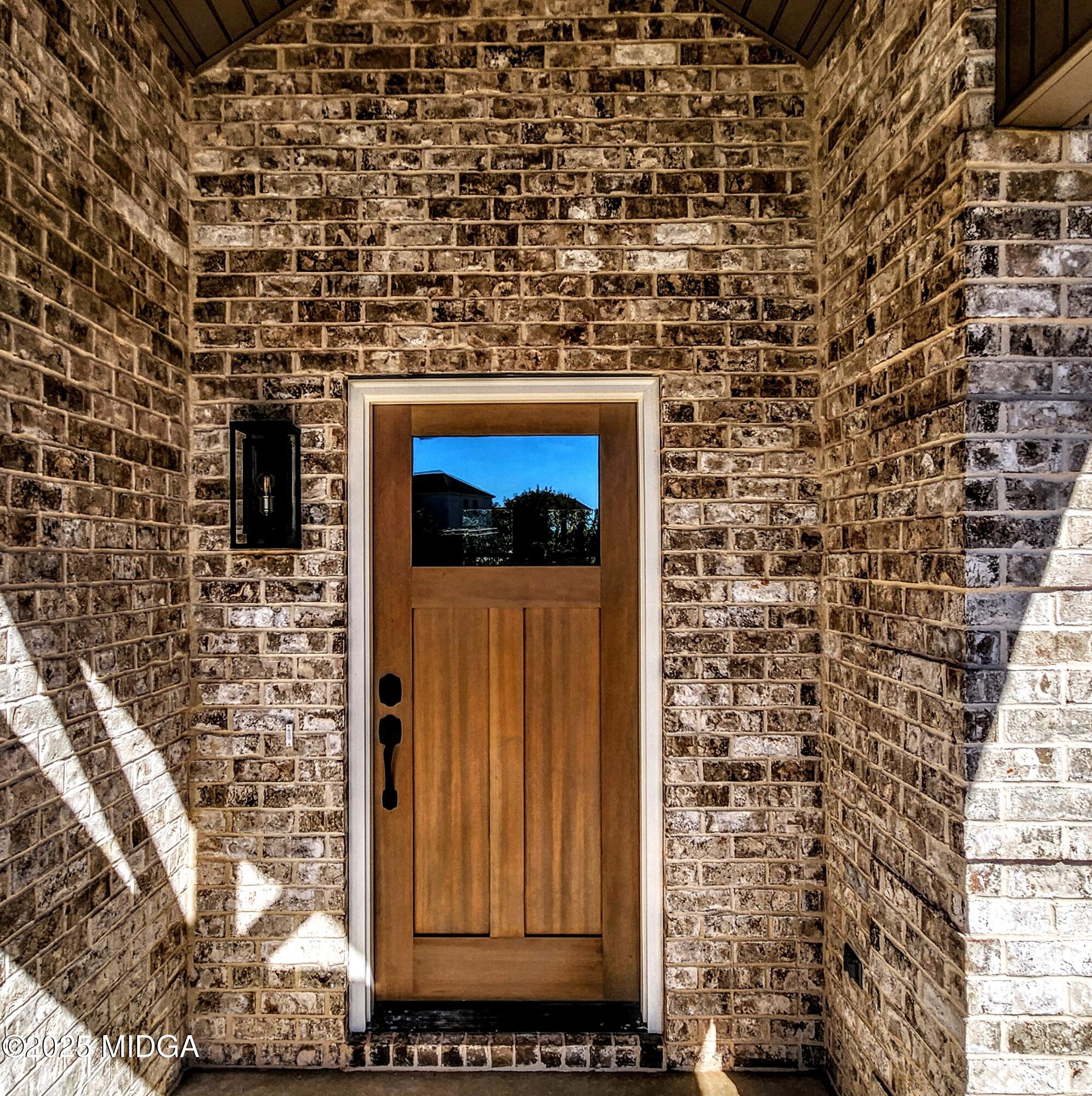 404 Minter Drive Warner Robins, GA 31088 - Photo 13 of 60 a brick building with a door